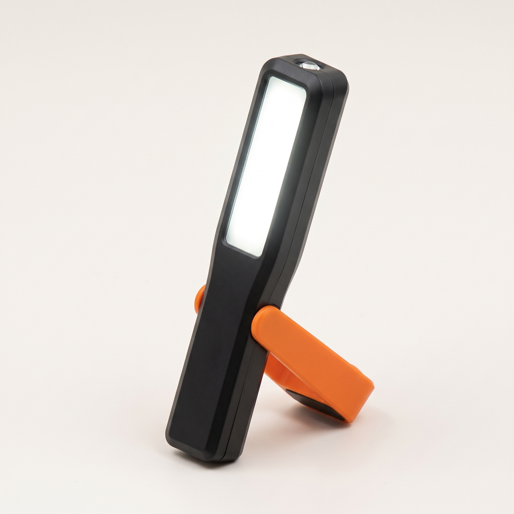 Warden Pivot magnetic work light standing on its fold-out bracket