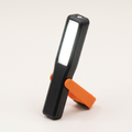 Warden Pivot magnetic work light standing on its fold-out bracket