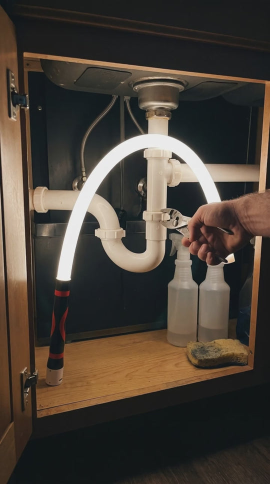 Flexline draped over a sink drain pipe