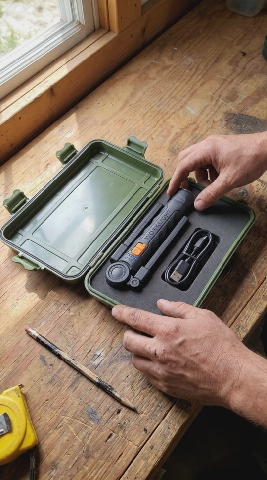 Fold 360 work light lifted out of its hard gift case