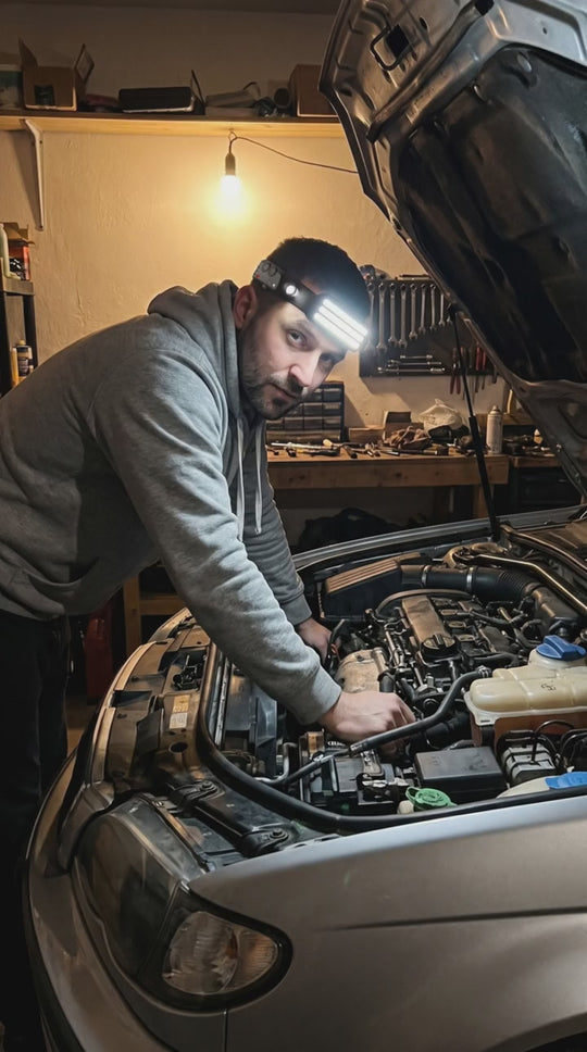 Halo 230 headlamp used on a car engine in a home garage