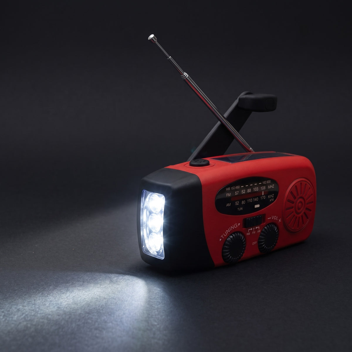 Warden Outpost emergency radio with the flashlight on and antenna extended