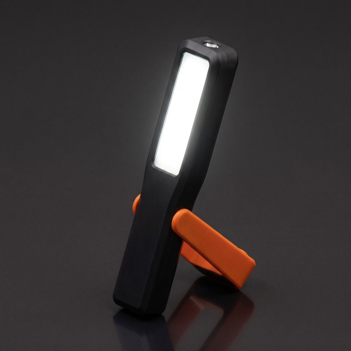 Pivot work light switched on, standing on its kickstand