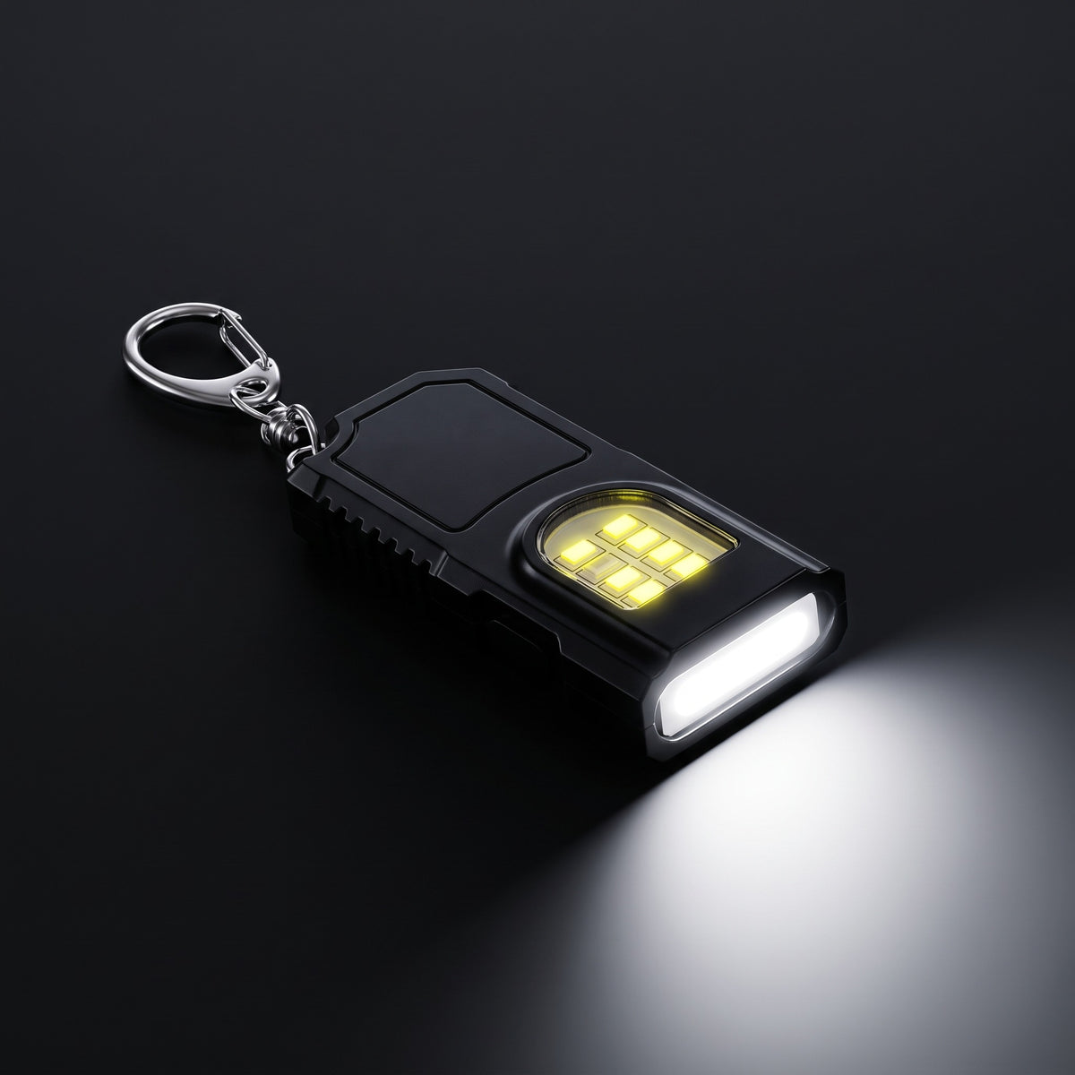 Spark keychain light switched on: COB flood and LED panel lit